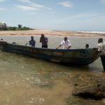 Volunteers in Canoe to Adjoa Village